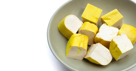 Yellow tofu on white background.