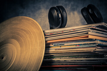 Vinyl record and headphones on grey background. Music concept. Copy space.
