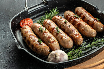 Sausages fried with spices and herbs. Grilling food, bbq, barbecue. place for text, top view