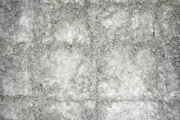 Obraz na płótnie Canvas Gray concrete wall, close-up texture, rough surface with cracks creates a natural abstract pattern