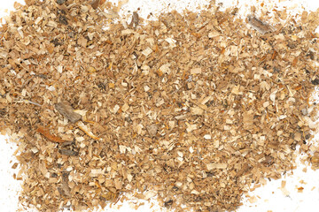 Wood texture shavings and sawdust isolated on white background . Pile of sawdust close up top view.