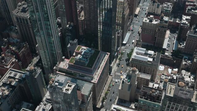 Beautiful top view of streets of Manhattan with moving traffic in New York. USA.