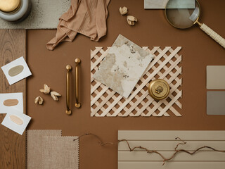 Creative flat lay composition in beige and brown color palette with textile and paint samples, lamella panels and tiles. Architect and interior designer moodboard. Top view. Copy space.