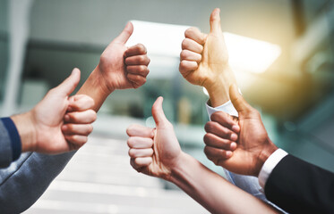 Thumbs up, agreement and hands with like of business people in office for success, yes and teamwork. Emoji, support and community with group of employees for goals, thank you and motivation