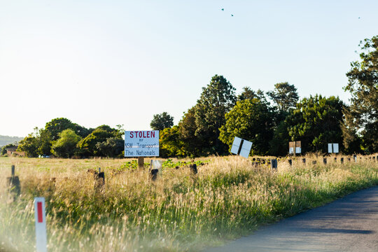Signs protesting forced land acquisition for Singleton Bypass