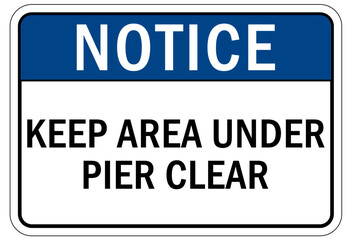 Beach safety warning sign and labels keep area under pier clear