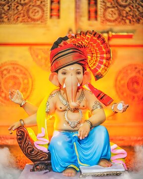 Ganesha sitting, lord ganesha sculpture over black background. celebrate lord ganesha festival.