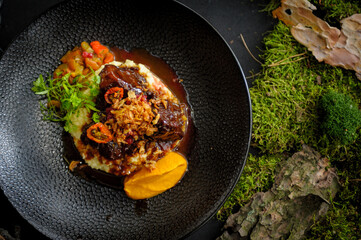 Beef cheeks with couscous risotto close up