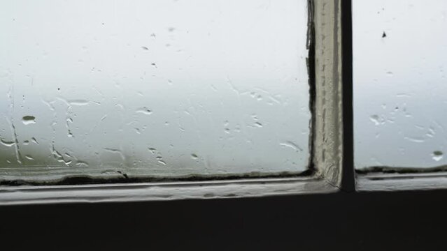 Rain drops on old window pains in spring