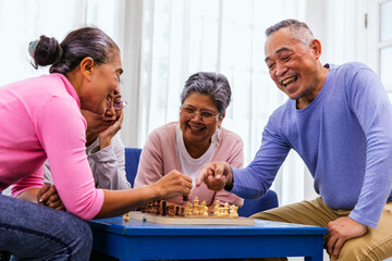 Person playing chess board game. Older Man playing chess. Hand of Senior man moving chess in...