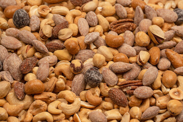 A group of almonds, pistachios, walnuts, macadamia, cashews.