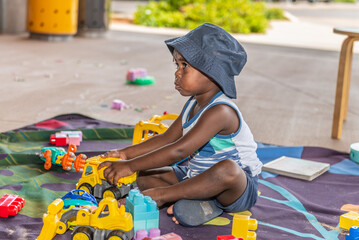 Aboriginal child playing with toys