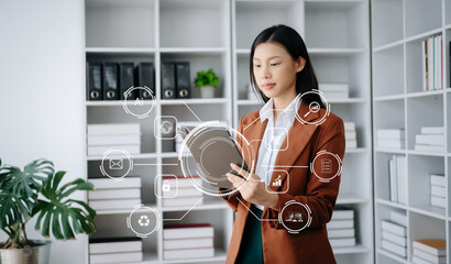 Businesswoman hand working digital marketing media in virtual screen with mobile phone and modern compute with VR icon diagram at office