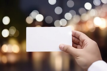 Hand holding white card with space to write, bokeh background, digital illustration. Generative AI