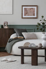 Spring composition of cozy living room interior with mock up poster frame, boucle sofa, wooden...
