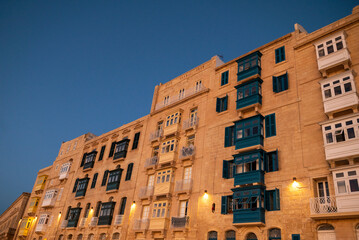 Old colored windows and a balcony in the old town. Malta