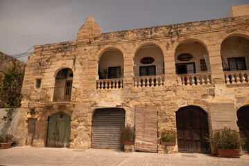 Old colored windows and a balcony in the old town. Malta