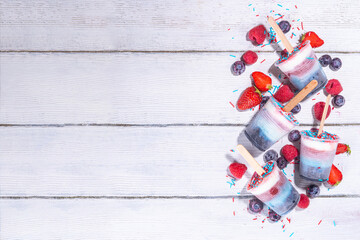 Red, white and blue ice pops.  Patriotic USA lollypops ice cream for july 4 party or bbq picnic, tasty popsicles with fruit berry flavours
