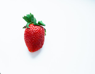 Ripe sweet fresh red strawberry on white background with copy space. Delicious summer berries.