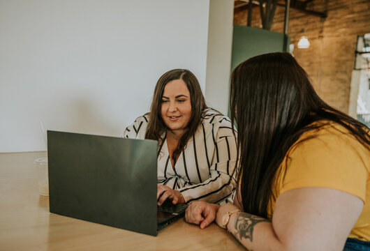 closeup of plus size women working on laptop