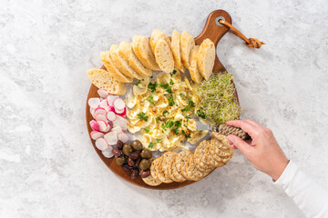 Butter board with vegetables and bread