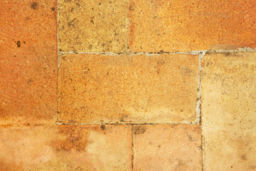 The surface is made of brick blocks in orange color. Copy space.