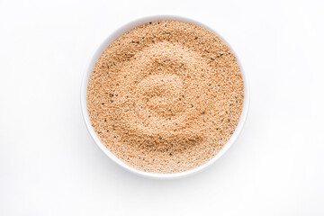 Amaranth seed in bowl isolated on white. Copy space. top view