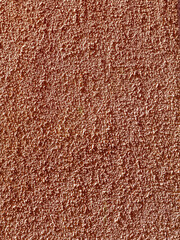 リシン仕上げの茶色い建物の外壁