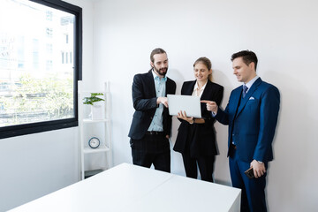 Group of business people using laptop brainstorming meeting teamwork. Effective people in organization use idea to consult their work. employees drive company.