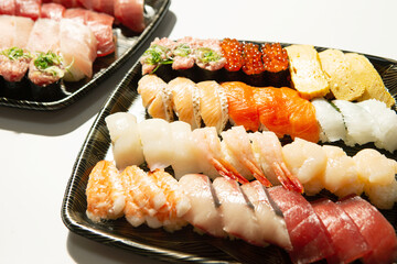 Different types of sushi on a plate	