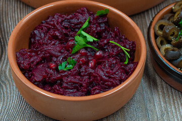 Beet salad in small clay dish as part of mezze or tapas