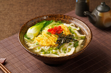 Special Chinese food chicken noodle soup on dark background