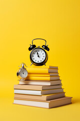 stack of books and clock on yellow background created with AI generative technology