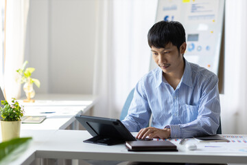 Businessman in casual clothes working alone in the office.