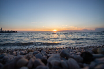Scenic sunset at Porec beach, Croatia