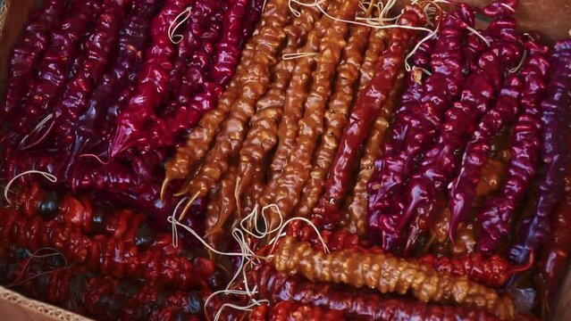 Churchkhela is a traditional georgian homemade sweets with nuts and grape juice on the local food market. High quality FullHD footage