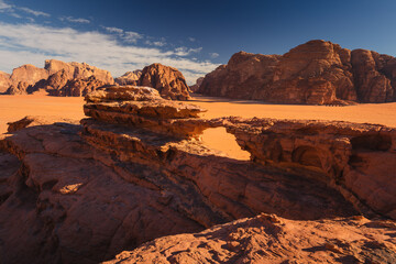 Fototapeta na wymiar Amazing and spectacular landscapes of Wadi Rum desert in Jordan. Dunes, rocks are all Beautiful weather gives the climate to this place.