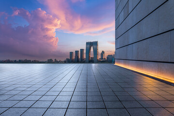 Empty floor and city skyline with building at sunset in Suzhou, China.