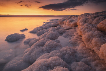 Landscapes from the Dead Sea in the light of the golden hour - interesting salt formations make an...