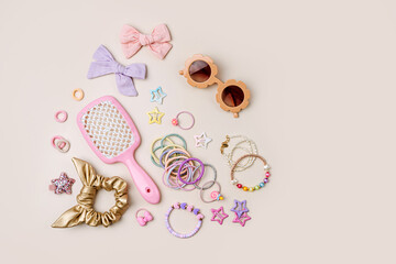 Set of baby girl hair accessories. Fashion hair bows, hair brush, hair clips, hairpins and hair elastics.  Hairstyles for girls with stylish accessory.