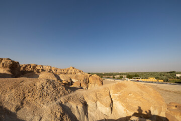 Sunset views across over the oasis town of Al Hasa from Al Qarah hills, Saudi Arabia