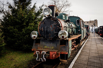 Fototapeta premium Classic steam engine at an open-air railway yard.