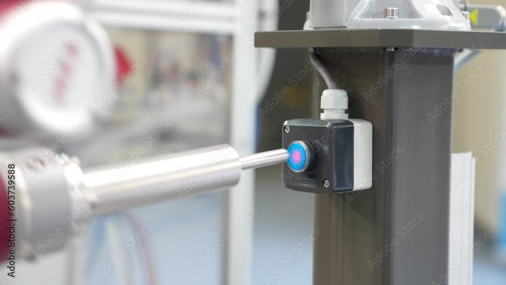 Poster Industrial Robot presses the button. Accuracy calibration