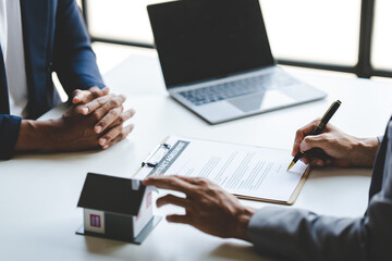 Real estate broker.Agents deliver sample houses to customers, mortgage contracts, loans, hire-purchase contracts and house sales. real estate concept