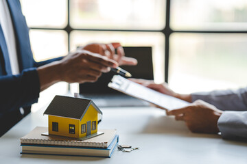 real estate agent Delivering keys and model homes to customers and home insurance contracts; home mortgage loan concepts
