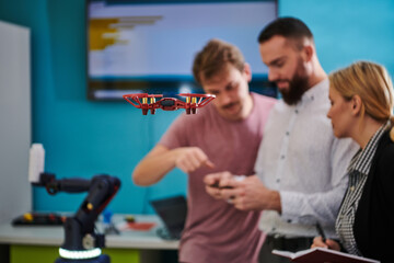  A group of students working together in a laboratory, dedicated to exploring the aerodynamic capabilities of a drone