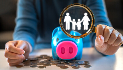 Magnifier glass focus family love care with coin and piggybank saving money, donation, saving, charity, finance, financial crisis, insurance, deposit, investment, bank, family finance saving plan