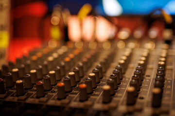Fototapeta na wymiar Sound equipment at a music studio. Sliders on a sound mixer.