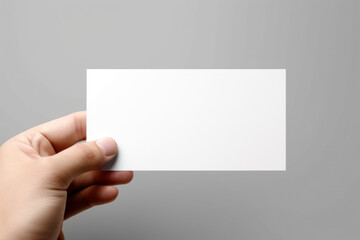 Obraz premium white blank business card in hand with copy space generative ai