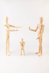Wooden puppets on white background. Family concept.